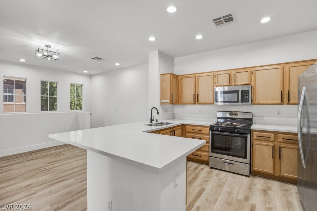 Your updated kitchen has Stainless Steel appliances, and Quartz Countertops.