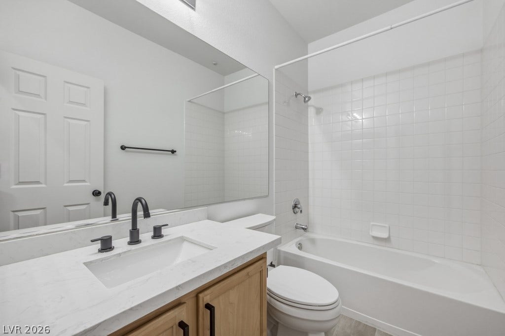 Full Guest Bathroom with tub/shower combo.