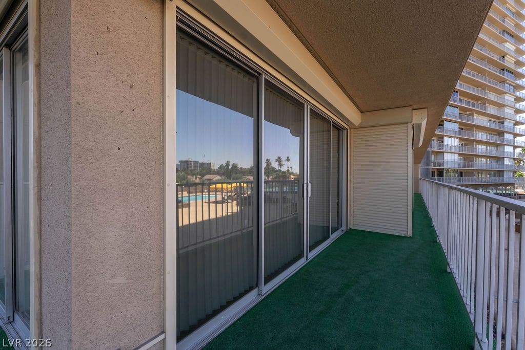 3111 Bel Air Drive, #3A, Las Vegas, NV 89109 A spacious balcony features covered protection and wide sliding glass doors.
