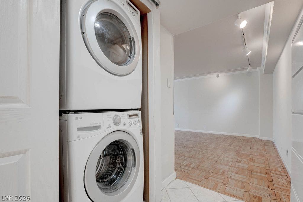 3111 Bel Air Drive, #3A, Las Vegas, NV 89109 Convenient in-unit laundry opens directly to a spacious living area with parquet wood flooring.