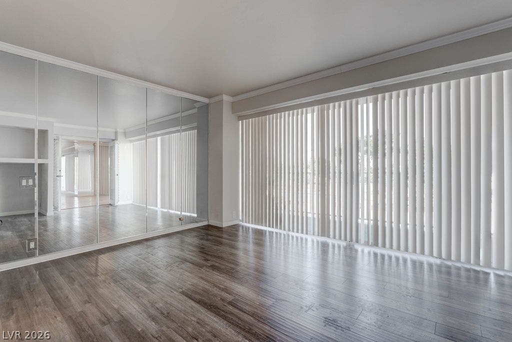 3111 Bel Air Drive, #3A, Las Vegas, NV 89109 Rich wood floors and clean crown molding anchor this versatile living space.