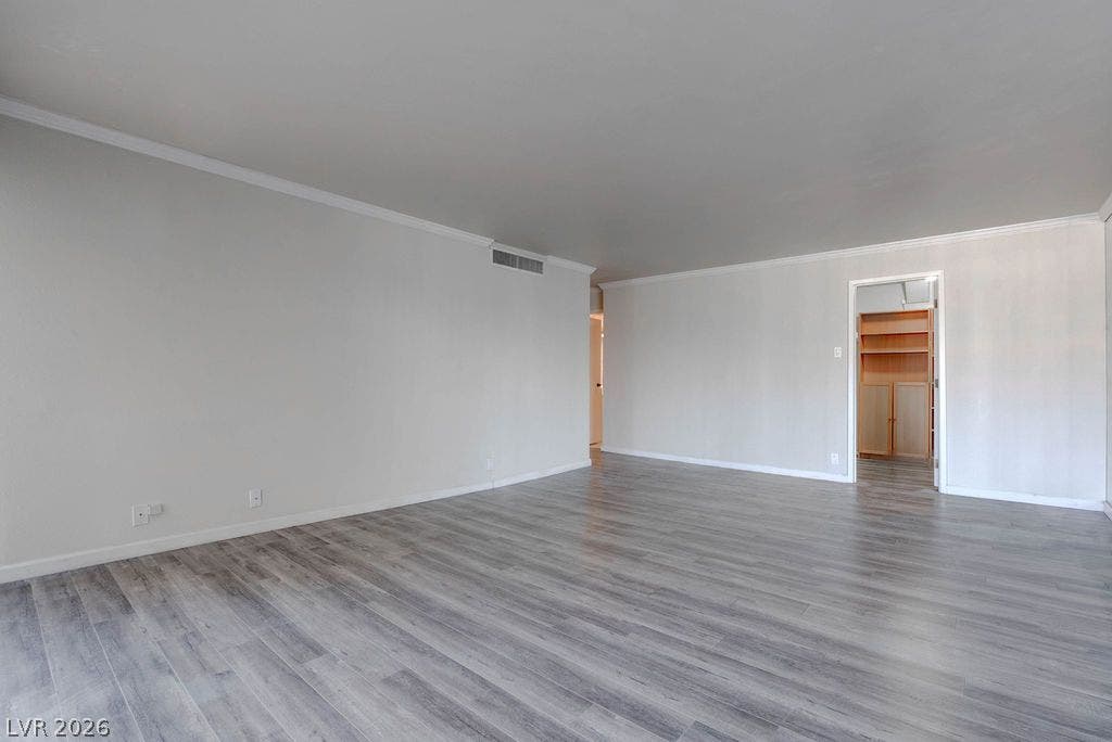 3111 Bel Air Drive, #3A, Las Vegas, NV 89109 Smooth crown molding accents the clean lines of this open living space with modern flooring.