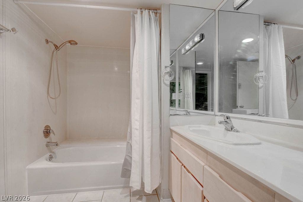 3111 Bel Air Drive, #3A, Las Vegas, NV 89109 Functional layout features a neutral vanity area alongside a combined tub and shower enclosure.