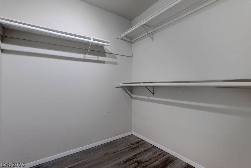 3111 Bel Air Drive, #3A, Las Vegas, NV 89109 Ample hanging rods and built-in shelving maximize storage space over handsome wood-look flooring.