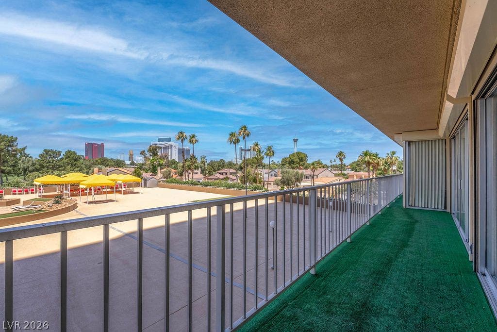 3111 Bel Air Drive, #3A, Las Vegas, NV 89109 Sliding glass doors open onto a private balcony overlooking a spacious courtyard.