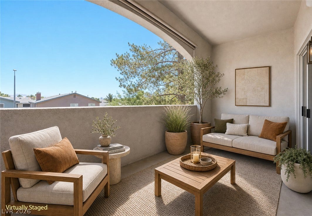 104 Lemon Glaze Street, #204, Las Vegas, NV 89145 An arched opening frames peaceful neighborhood views from this private covered balcony.