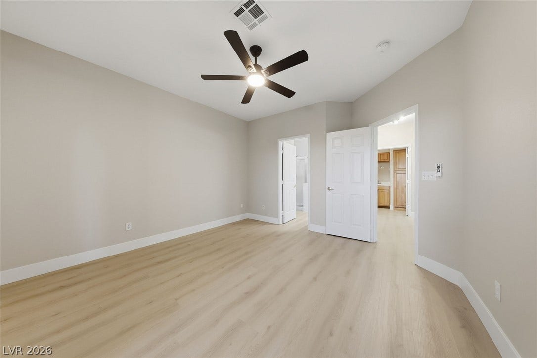 104 Lemon Glaze Street, #204, Las Vegas, NV 89145 Smooth plaster walls and light plank flooring define this clean, versatile bedroom space.