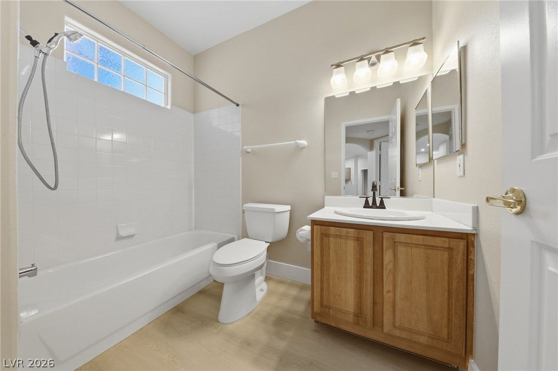 104 Lemon Glaze Street, #204, Las Vegas, NV 89145 High ceilings and a transom window bring natural light into this classic bathroom.