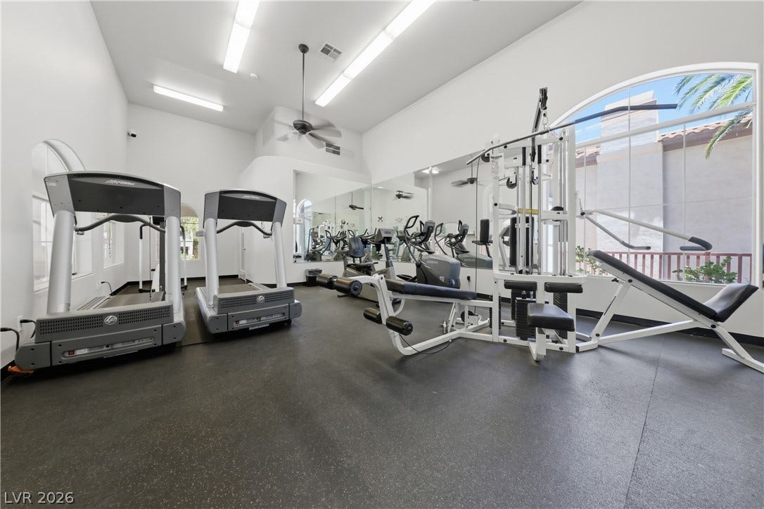 104 Lemon Glaze Street, #204, Las Vegas, NV 89145 A spacious fitness room features high ceilings and a large arched window.