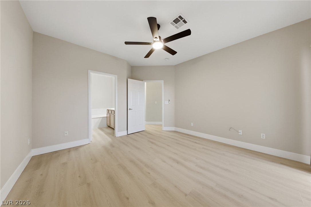 104 Lemon Glaze Street, #204, Las Vegas, NV 89145 Smooth plaster walls and light oak floors define this serene private suite.