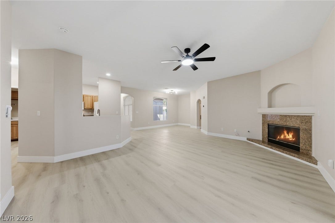 104 Lemon Glaze Street, #204, Las Vegas, NV 89145 An open living space highlights clean modern flooring and a classic corner fireplace.
