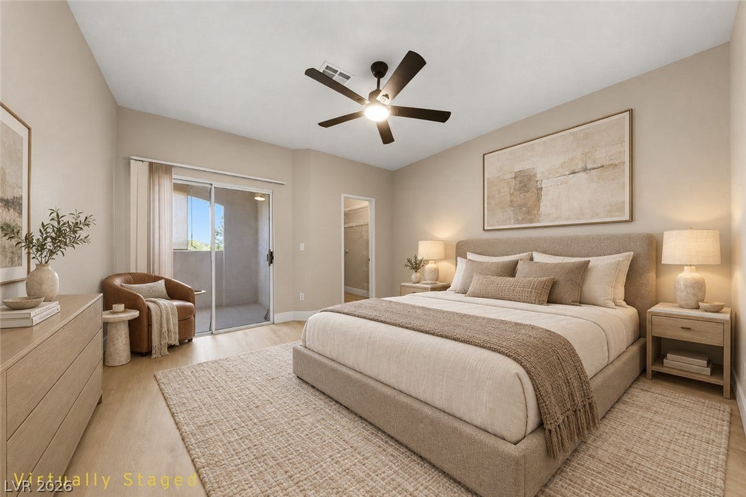 104 Lemon Glaze Street, #204, Las Vegas, NV 89145 A spacious layout features wood-style flooring and direct access to a private balcony.
