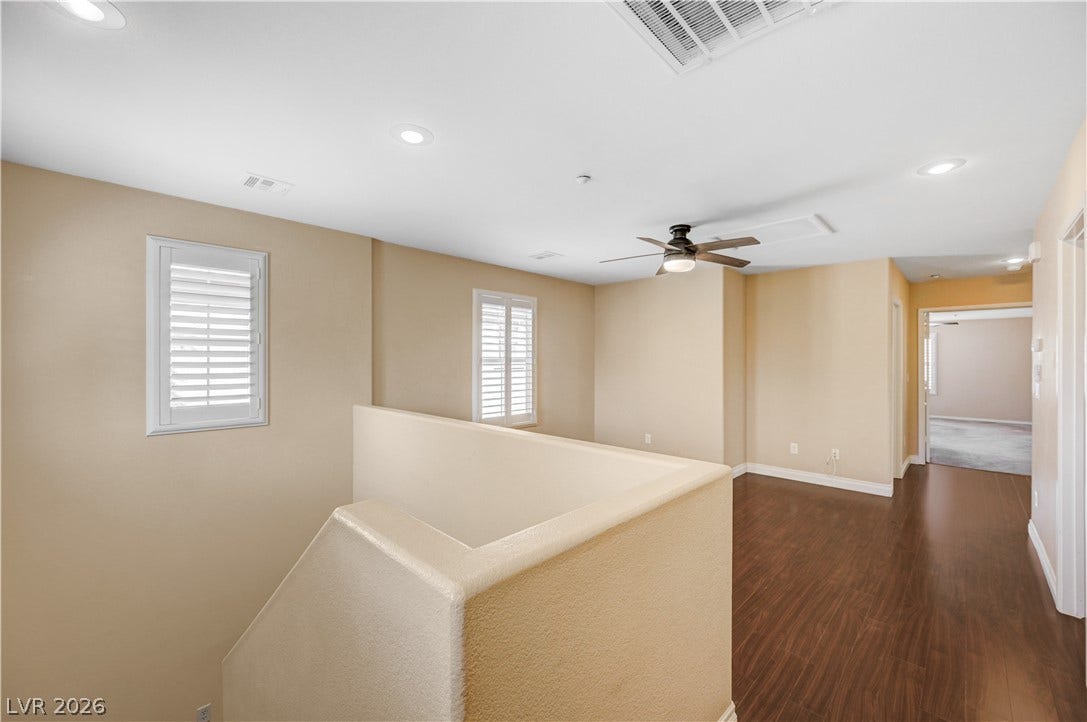 2088 Artistic Flair Walk, Henderson, NV 89044 Rich laminate wood flooring pairs with clean lines and recessed lighting on this inviting upper level.