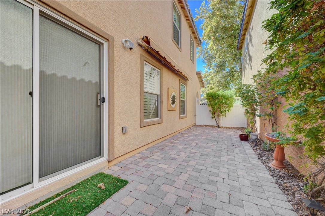 2088 Artistic Flair Walk, Henderson, NV 89044 An inviting paved courtyard provides a private outdoor retreat framed by stucco walls.