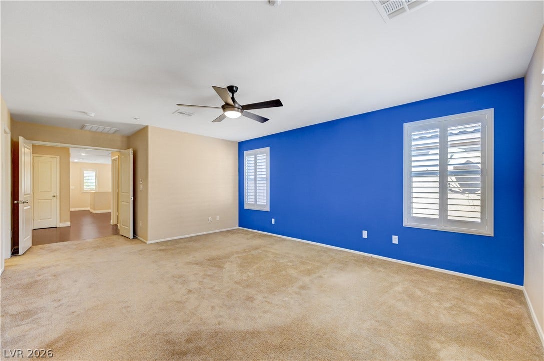 2088 Artistic Flair Walk, Henderson, NV 89044 Plentiful natural light streams through multiple windows into this carpeted bedroom.