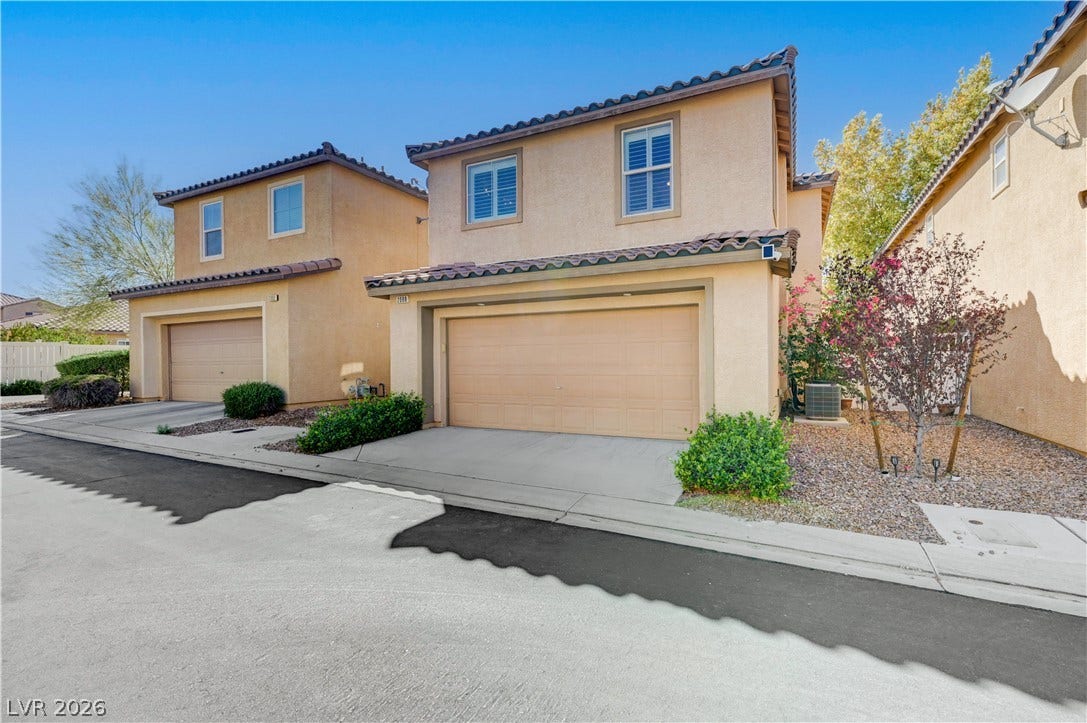 2088 Artistic Flair Walk, Henderson, NV 89044 Spanish tile roofing and stucco siding enhance the classic exterior of this two-story residence.