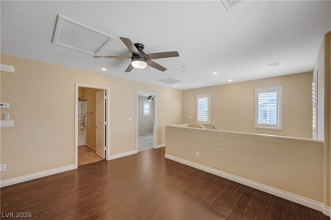 2088 Artistic Flair Walk, Henderson, NV 89044 Warm laminate wood flooring and recessed lighting define this versatile second-floor loft space.