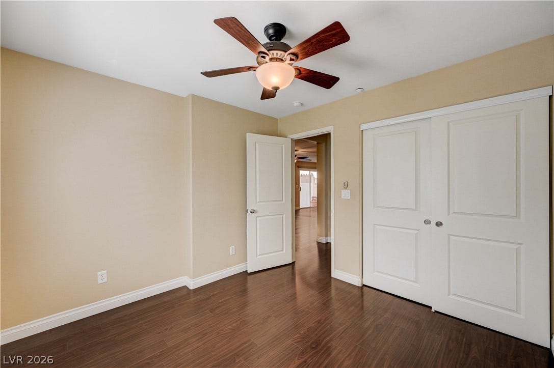 2088 Artistic Flair Walk, Henderson, NV 89044 Downstairs bedroom with rich laminate wood flooring runs throughout this versatile bedroom featuring a spacious closet.