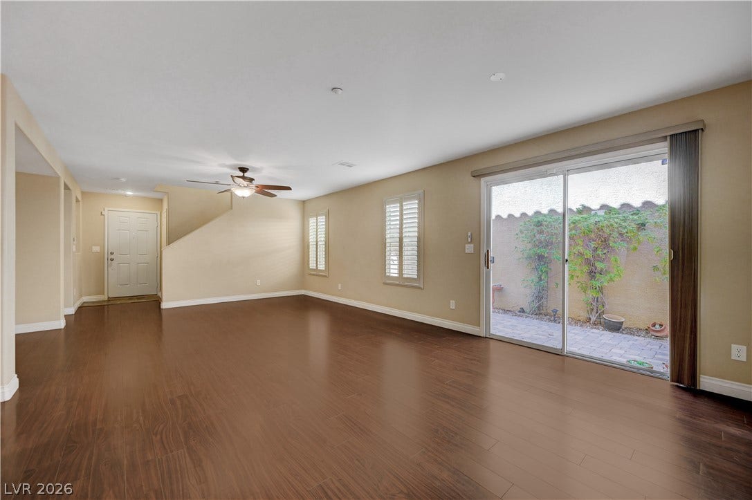 2088 Artistic Flair Walk, Henderson, NV 89044 Rich laminate wood flooring runs throughout this airy living space complete with sliding glass doors.