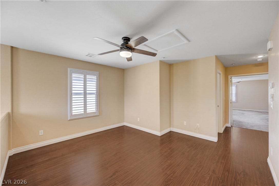 2088 Artistic Flair Walk, Henderson, NV 89044 Laminate wood floors and classic plantation shutters enhance this versatile upper level loft space.