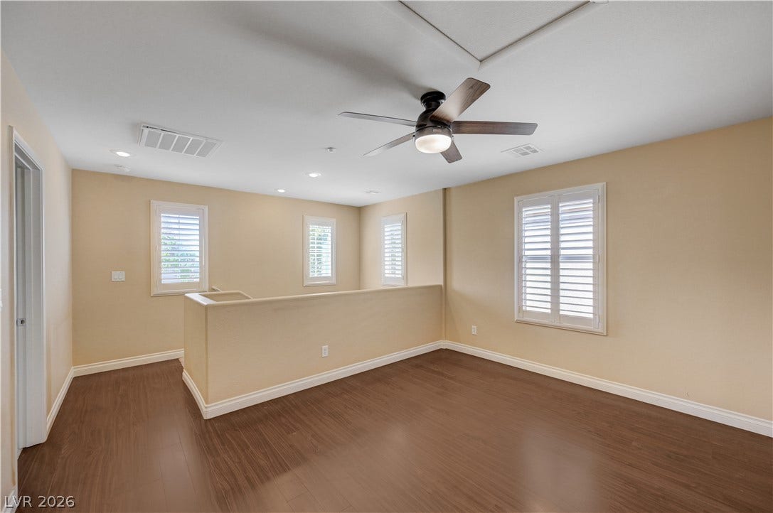 2088 Artistic Flair Walk, Henderson, NV 89044 Rich wood-inspired floors and classic plantation shutters define this versatile upper-level bonus space.