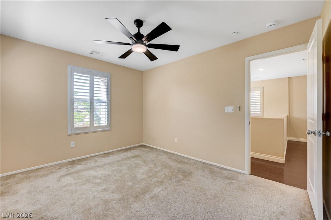 2088 Artistic Flair Walk, Henderson, NV 89044 Upstairs bedroom with carpeting anchors this inviting bedroom space featuring plantation shutters.
