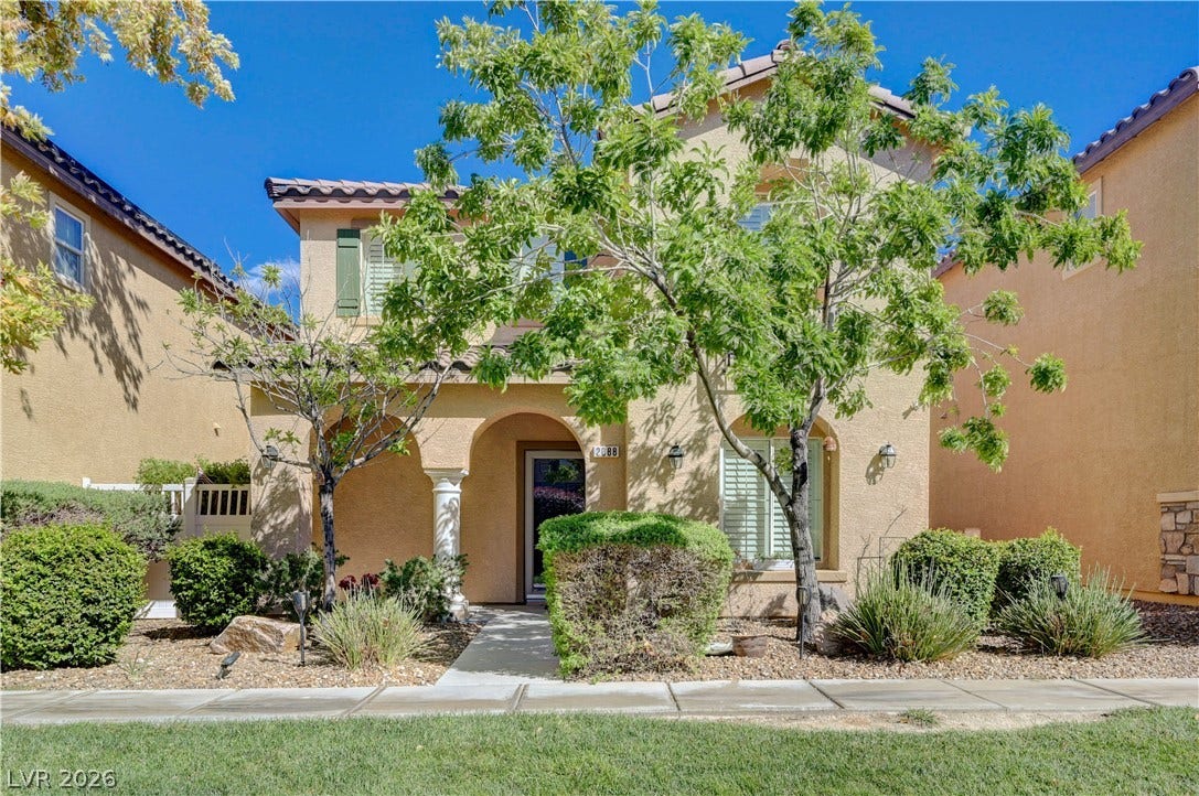 2088 Artistic Flair Walk, Henderson, NV 89044 Graceful archways and mature landscaping frame the welcoming front entrance of this 2-story home.