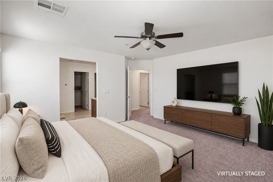 4429 Ginger Hills Avenue, Las Vegas, NV 89141 An inviting bedroom features clean lines, soft carpeting, and access to an adjoining closet.
