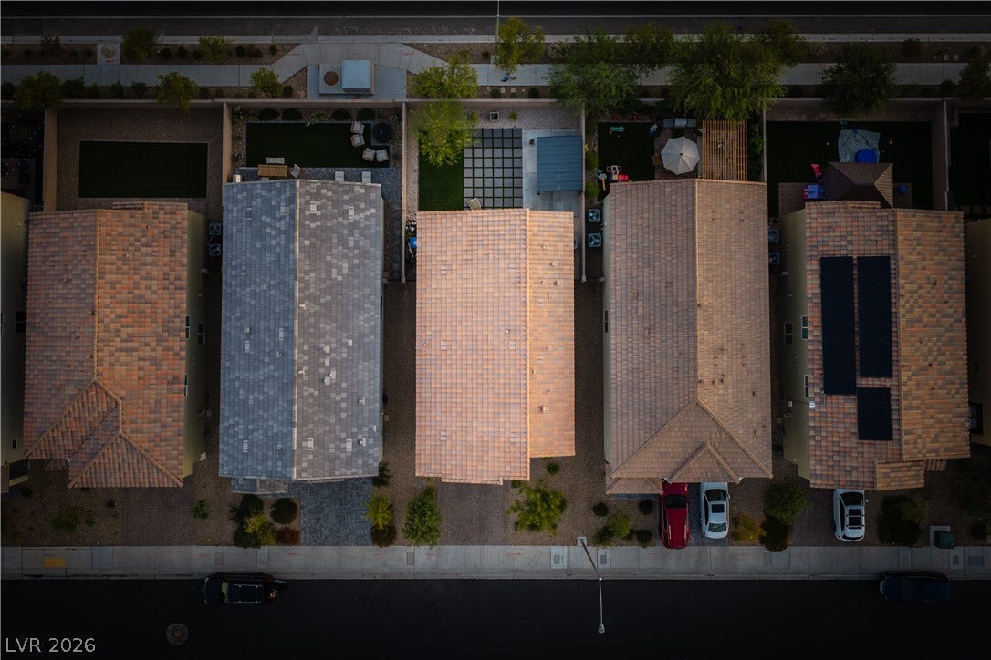4429 Ginger Hills Avenue, Las Vegas, NV 89141 An aerial perspective showcases the tidy alignment of neighborhood rooftops and private backyard spaces.