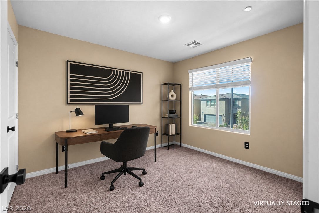 4429 Ginger Hills Avenue, Las Vegas, NV 89141 Recessed lighting, plush carpeting, and a wide window create a focused, comfortable workspace.