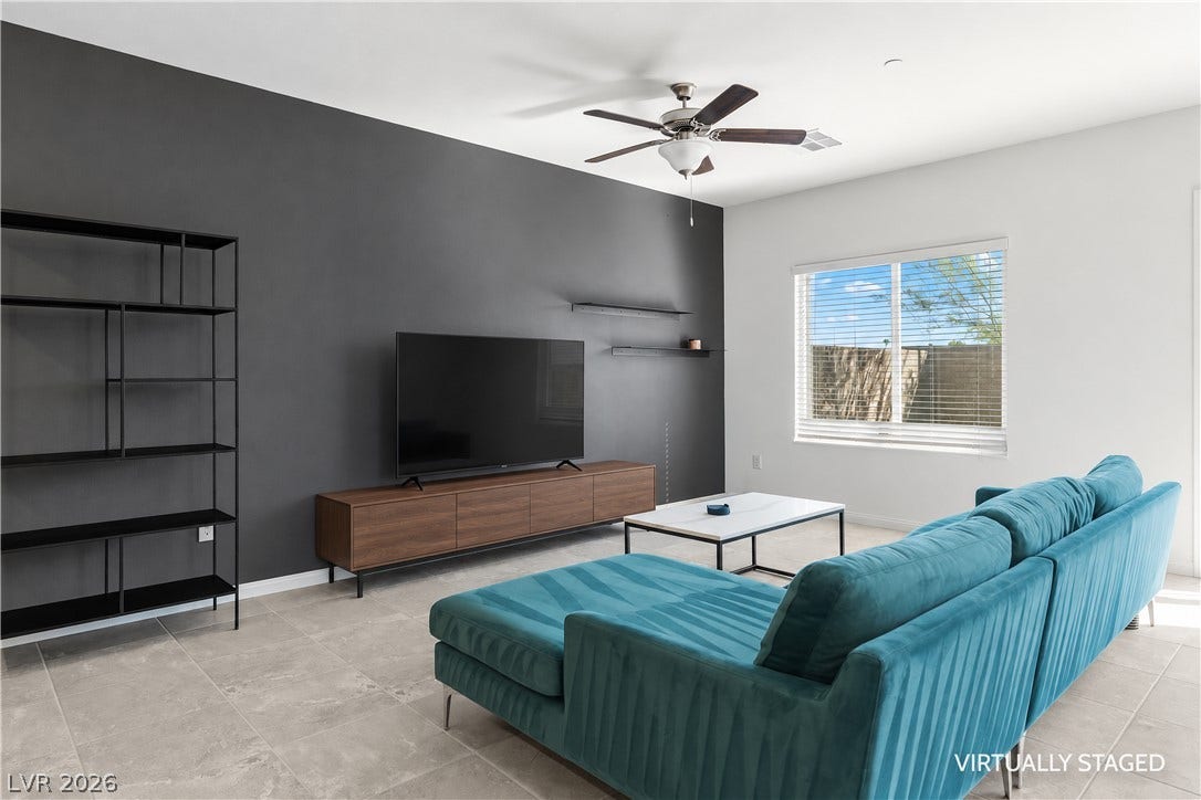 4429 Ginger Hills Avenue, Las Vegas, NV 89141 Tiled flooring and a large window anchor this versatile living space.
