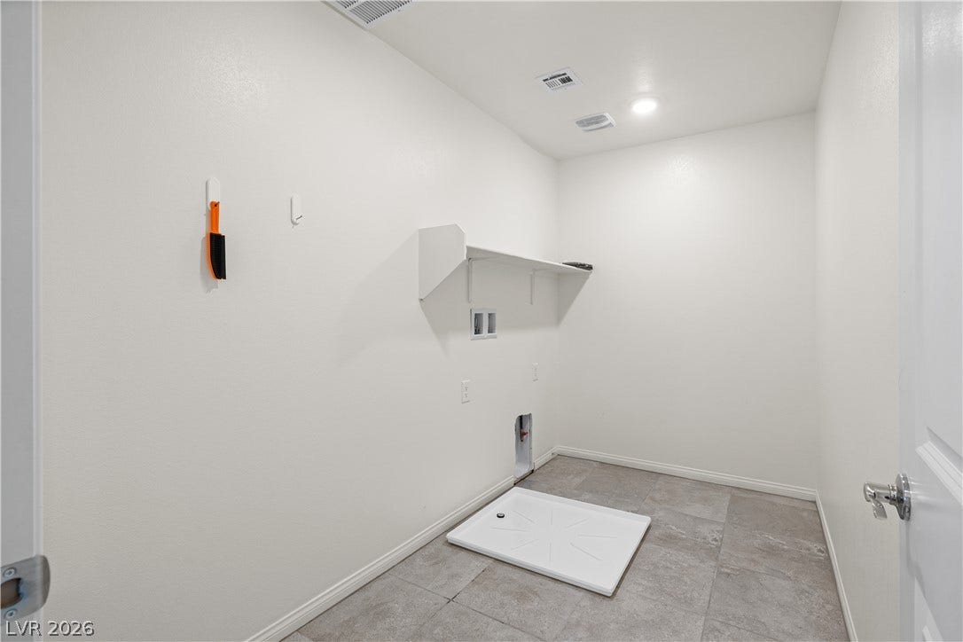 4429 Ginger Hills Avenue, Las Vegas, NV 89141 Functional utility space features durable tile flooring and overhead shelving.