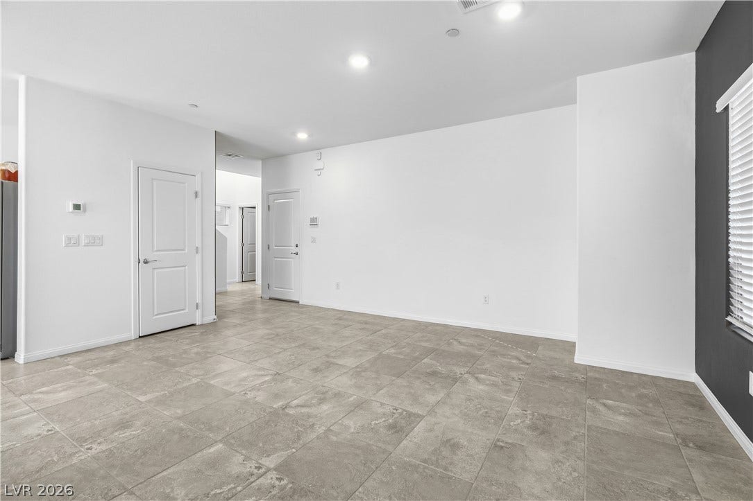 4429 Ginger Hills Avenue, Las Vegas, NV 89141 Durable tile flooring and recessed lighting define this versatile open living space.