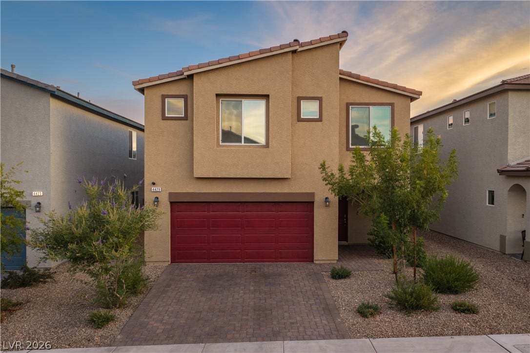 4429 Ginger Hills Avenue, Las Vegas, NV 89141 Modern desert architecture combines with a paved driveway and clean stucco lines.