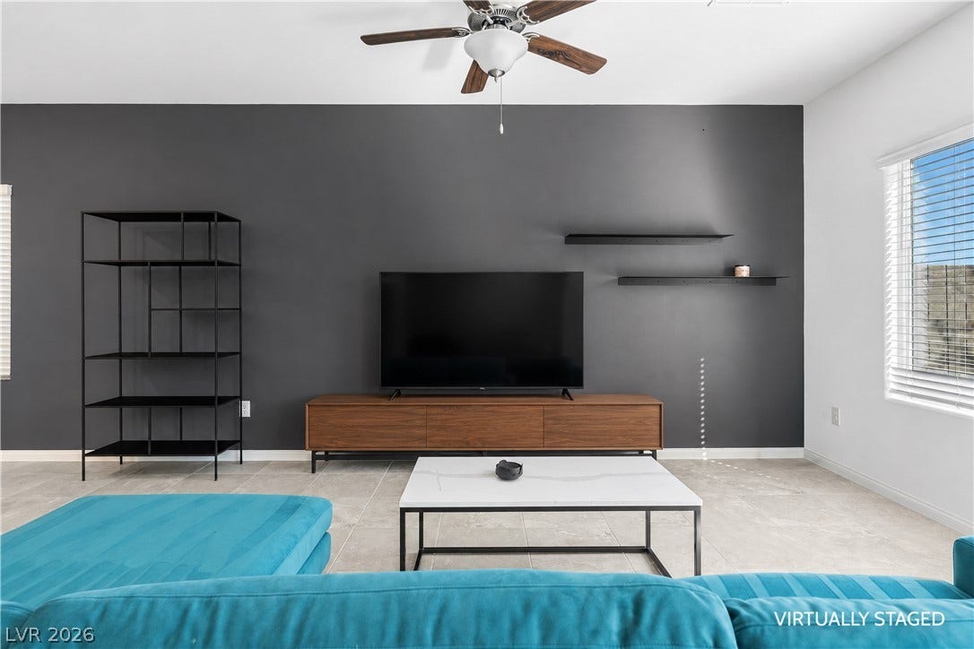 4429 Ginger Hills Avenue, Las Vegas, NV 89141 Large windows and tiled flooring define this modern living space.