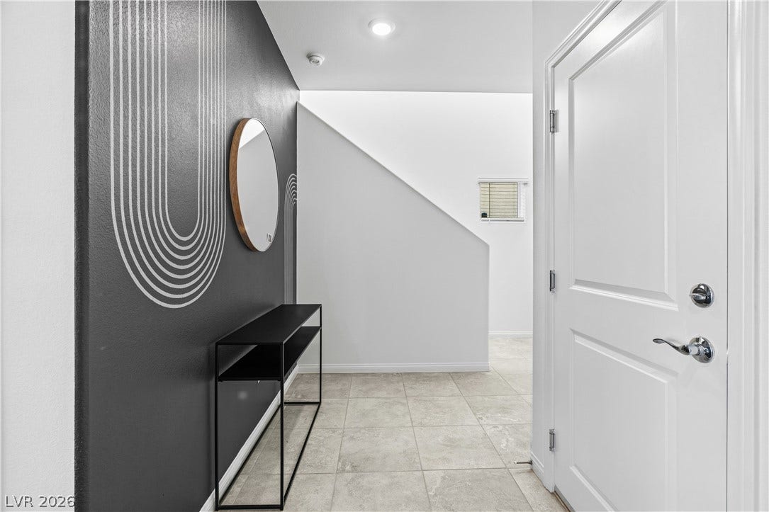 4429 Ginger Hills Avenue, Las Vegas, NV 89141 A welcoming entryway features tile flooring, recessed lighting, and crisp white trim.