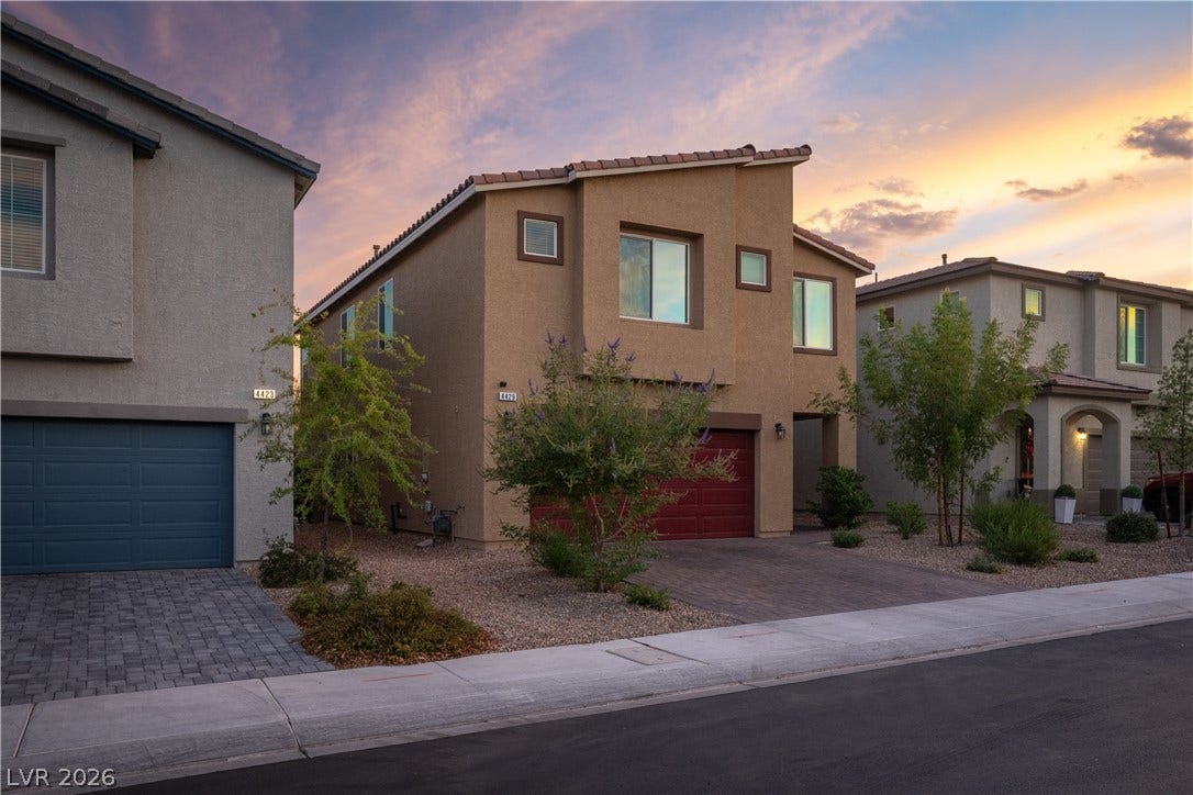 4429 Ginger Hills Avenue, Las Vegas, NV 89141 Clean lines and native desert landscaping define this modern multi-level exterior silhouette under twilight skies.