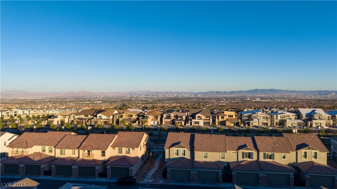 Panoramas of the city skyline and distant mountains unfold from this elevated neighborhood vantage.