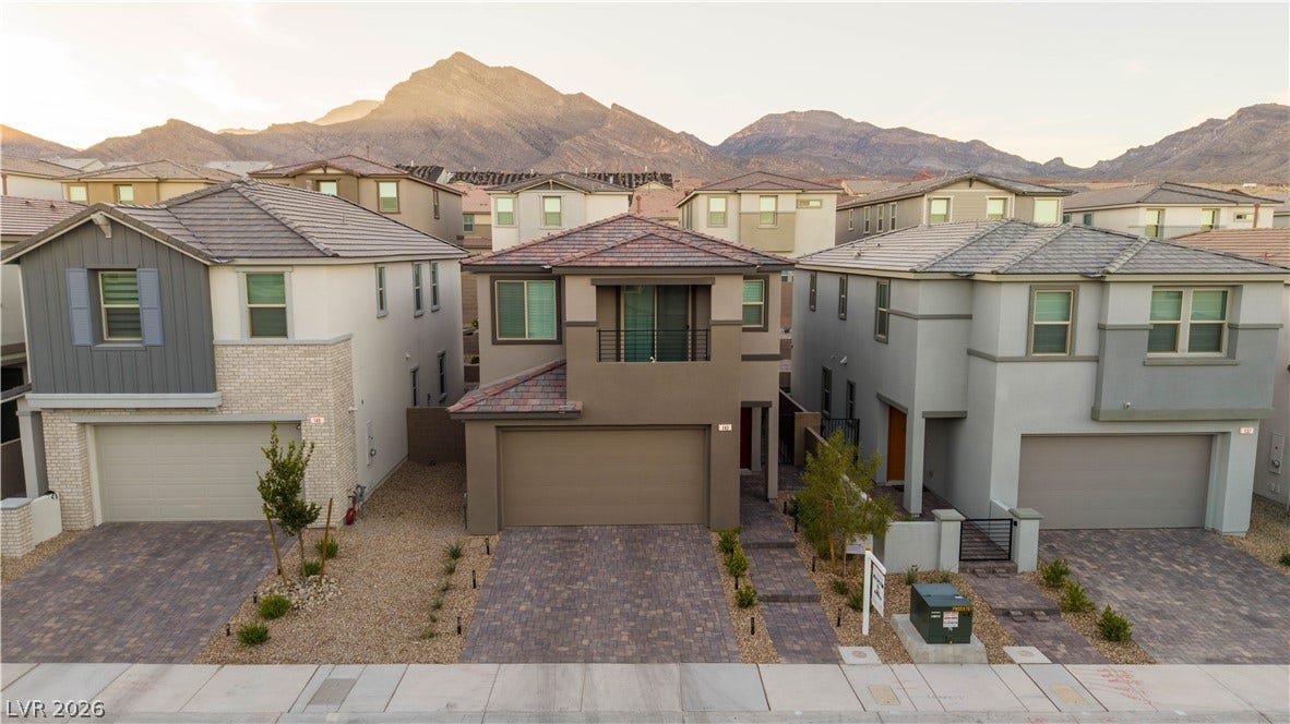 Majestic mountain ridges provide a dramatic backdrop for these modern multi-level homes.