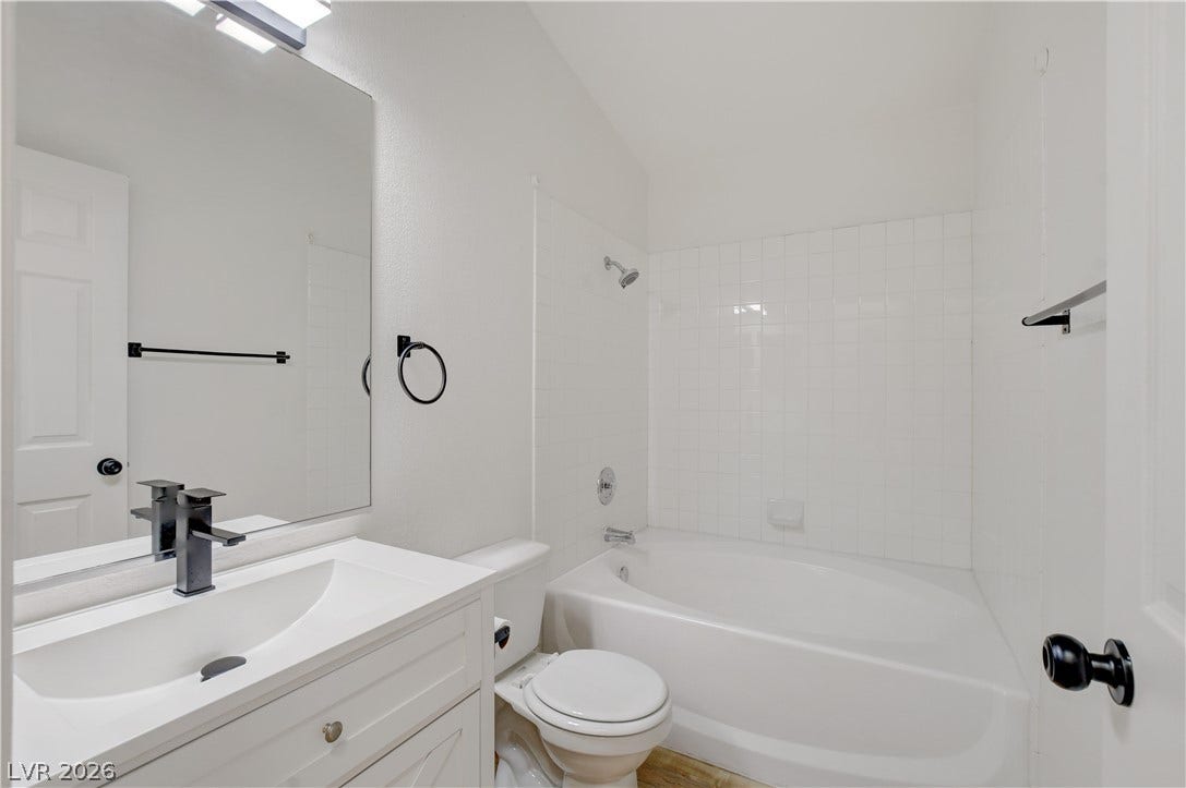 3676 Renovah Street, #205, Las Vegas, NV 89129 Crisp tiled walls and a deep soaking tub anchor this modern full bath.