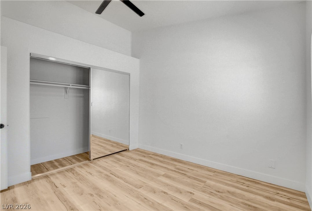 3676 Renovah Street, #205, Las Vegas, NV 89129 Gleaming wood floors and a mirrored closet maximize space in this airy room.
