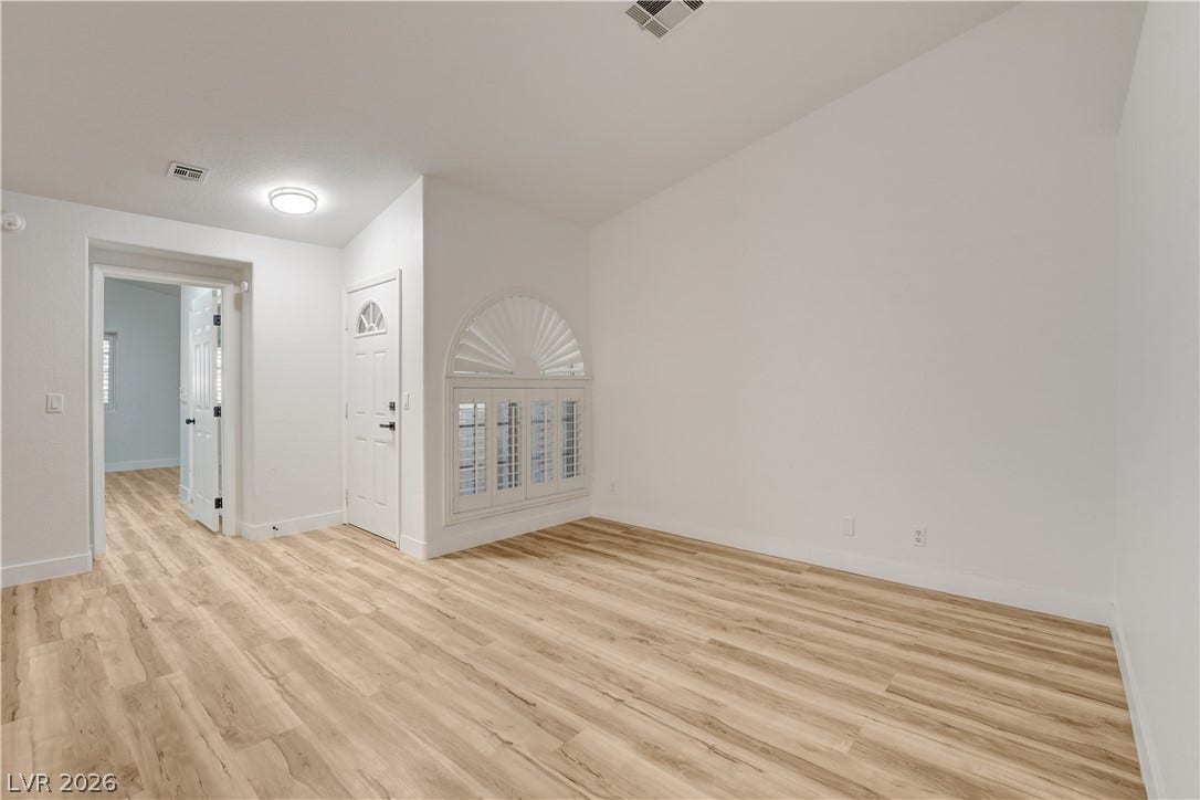 3676 Renovah Street, #205, Las Vegas, NV 89129 High ceilings and durable wood-look flooring establish an airy, modern welcome at the entrance.