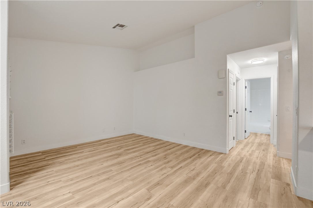 3676 Renovah Street, #205, Las Vegas, NV 89129 Gleaming wood floors run throughout this versatile living space with high ceilings.