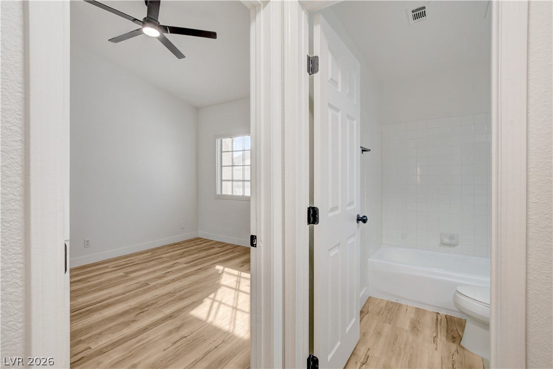 3676 Renovah Street, #205, Las Vegas, NV 89129 Clean lines and durable plank flooring define this functional bedroom and bathroom layout.
