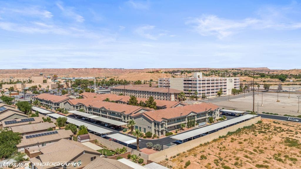 100 Pulsipher Lane, #1205, Mesquite, NV 89027 Distant desert mesas frame a sweeping view of the surrounding neighborhood and residential structures.