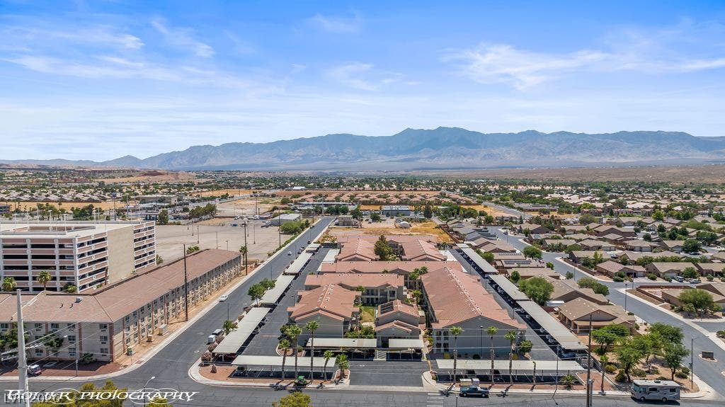 100 Pulsipher Lane, #1205, Mesquite, NV 89027 Majestic mountain ridges frame the expansive neighborhood landscape under clear desert skies.