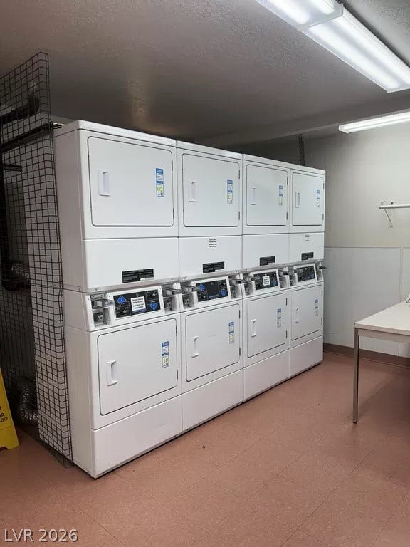 100 Pulsipher Lane, #1205, Mesquite, NV 89027 A functional shared laundry space provides multiple stacked washing and drying machines.