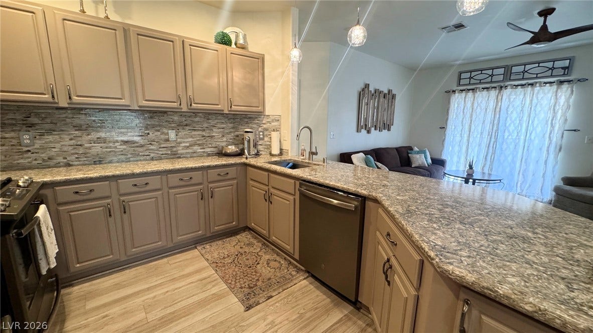 8304 Apple Glaze Avenue, #203, Las Vegas, NV 89145 An open kitchen layout transitions smoothly into the adjoining living space.