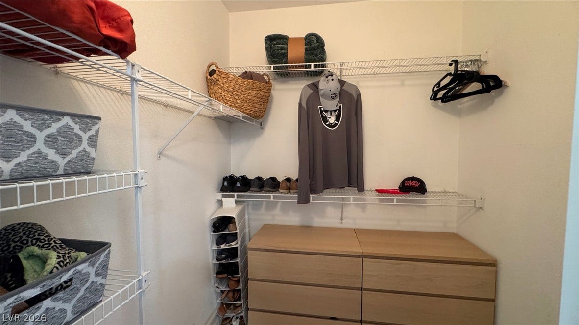 8304 Apple Glaze Avenue, #203, Las Vegas, NV 89145 A spacious walk-in closet provides abundant wire shelving and storage options.