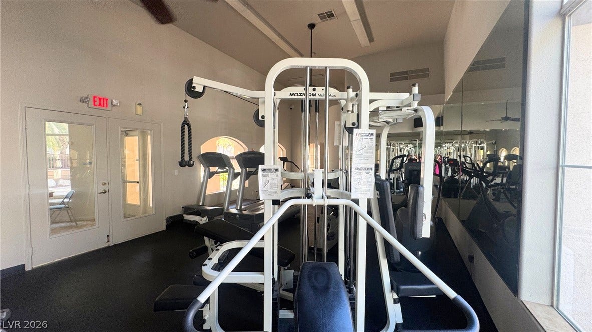 8304 Apple Glaze Avenue, #203, Las Vegas, NV 89145 Mirrored walls and high ceilings enhance this dedicated workout space.
